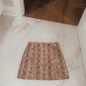 Snakeskin above the knee skirt